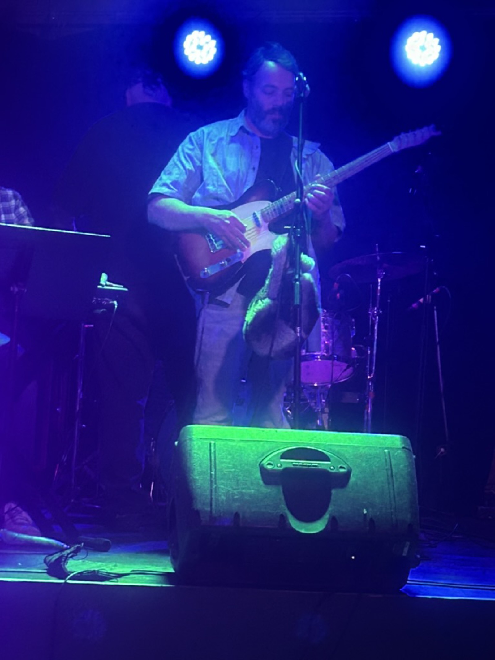 Micha performing live on guitar